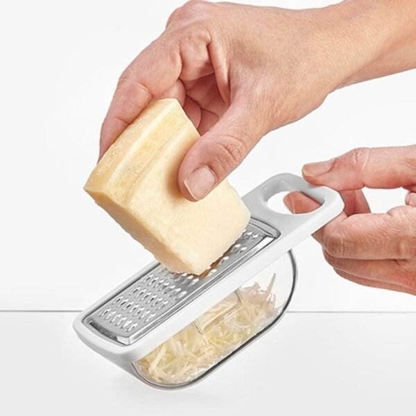 Rallador de queso de acero inoxidable con depósito dispensador de plástico